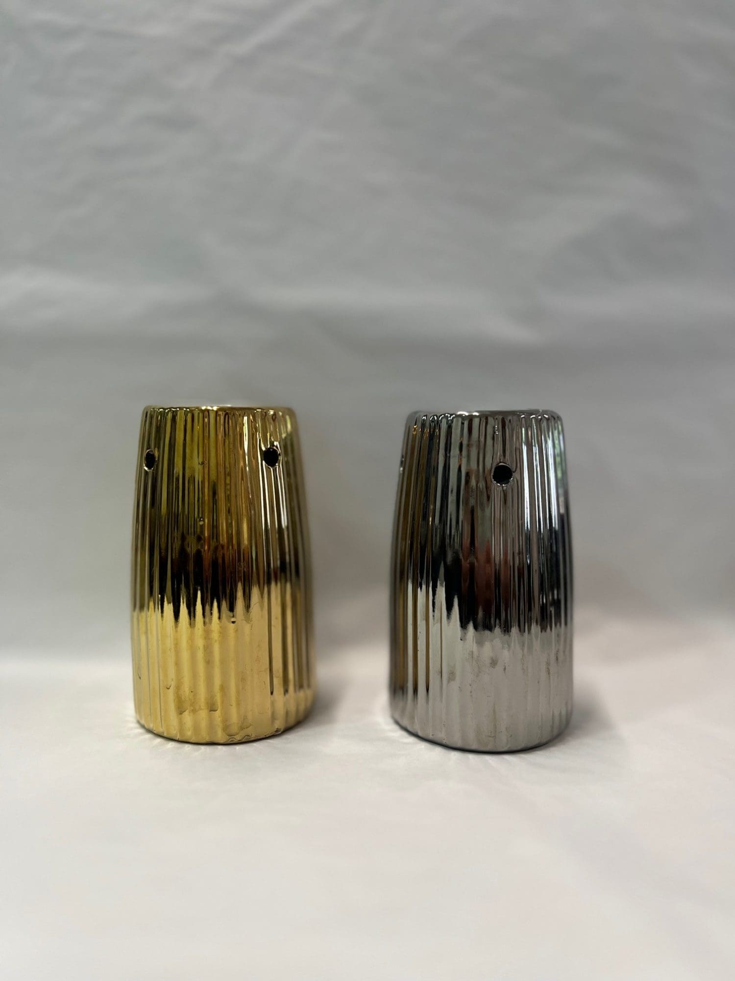 Metallic wax melt burner