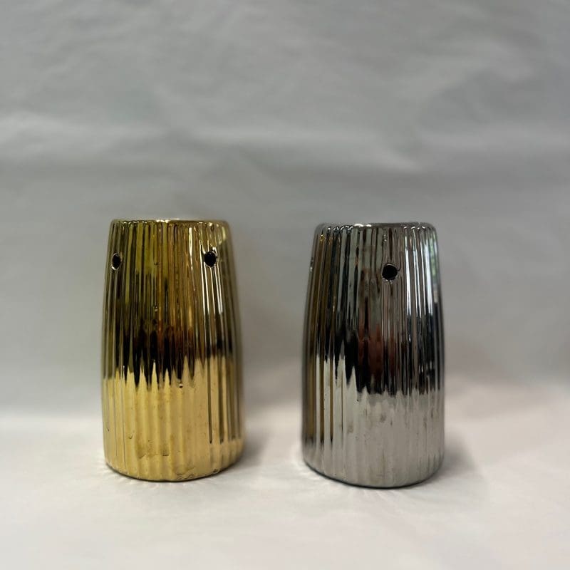 Metallic wax melt burner